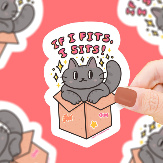 Pegatina con forma de gato metido en una caja de cartón y el texto "If I fits, I sits!"