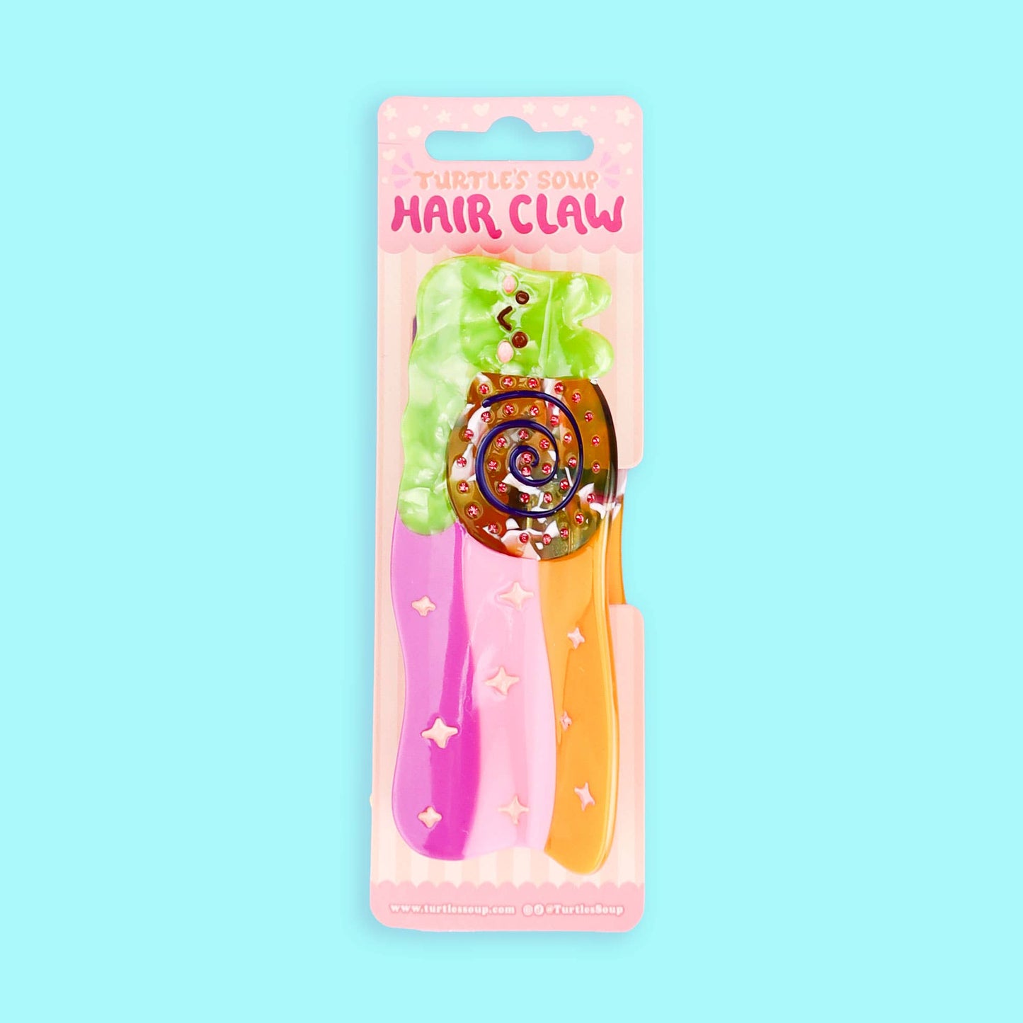 Pinza para el pelo de colores con forma de caracol dejando rastro de arcoiris