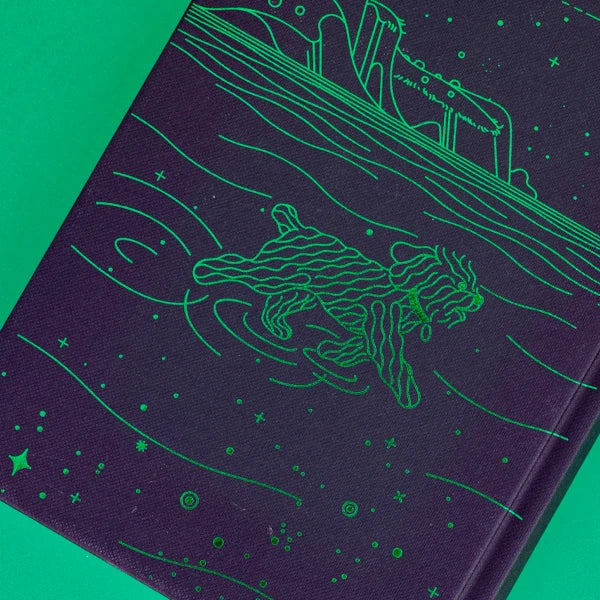 Contraportada de la agenda de Blackie Books para 2024 con un perrito de aguas, mascota de la editorial