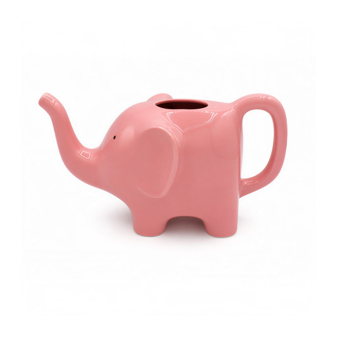 Regadera rosa en forma de elefante sobre fondo blanco.