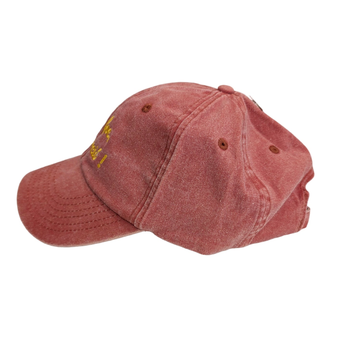 vista lateral de la gorra de color teja con el texto llum foc destrucció en color amarillo