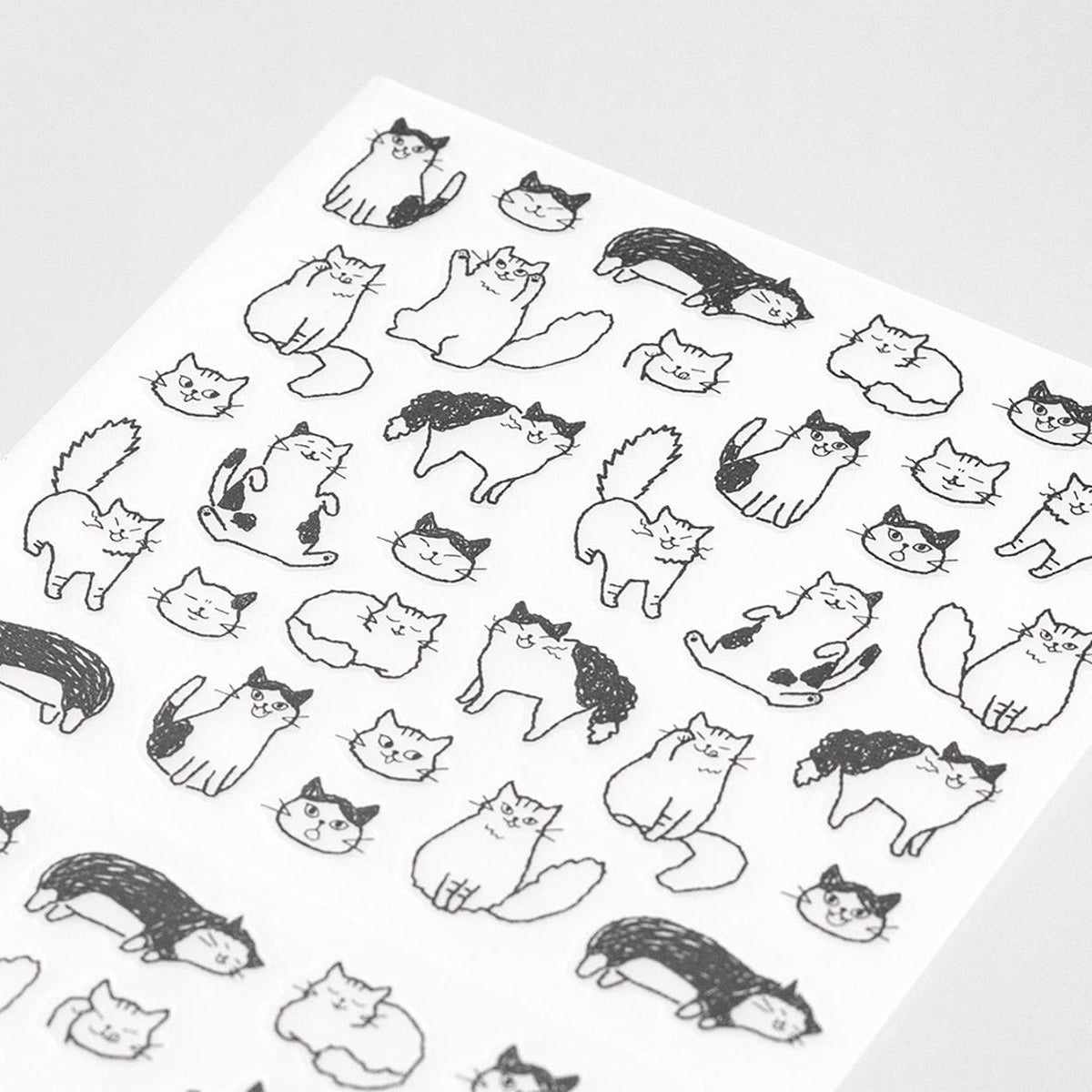 Hoja de pegatinas de gatos en diferentes posturas para decorar agendas, libretas o diarios