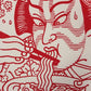 Detalle de la ilustración en blanco y rojo de un actor de kabuki comiendo ramen con palillos con estilo tradicional japonés