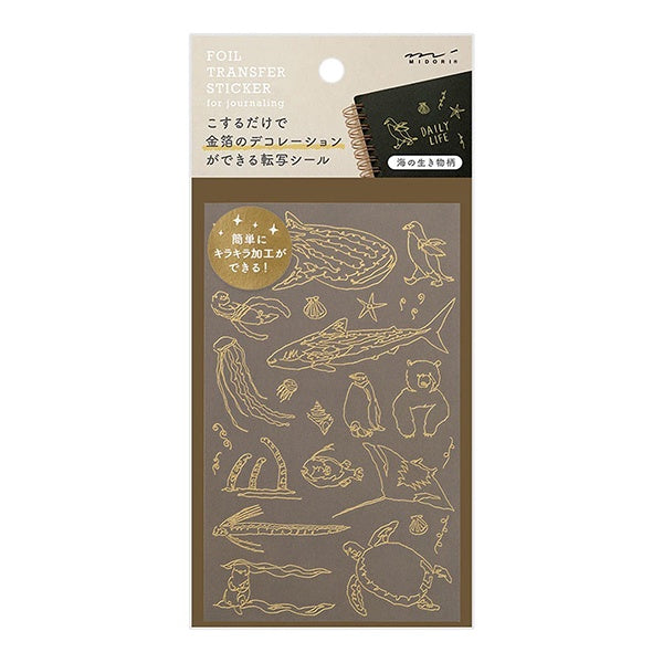Calcomanias o pegatinas transferibles en dorado con motivos marimos para decorar libretras u otros objetos