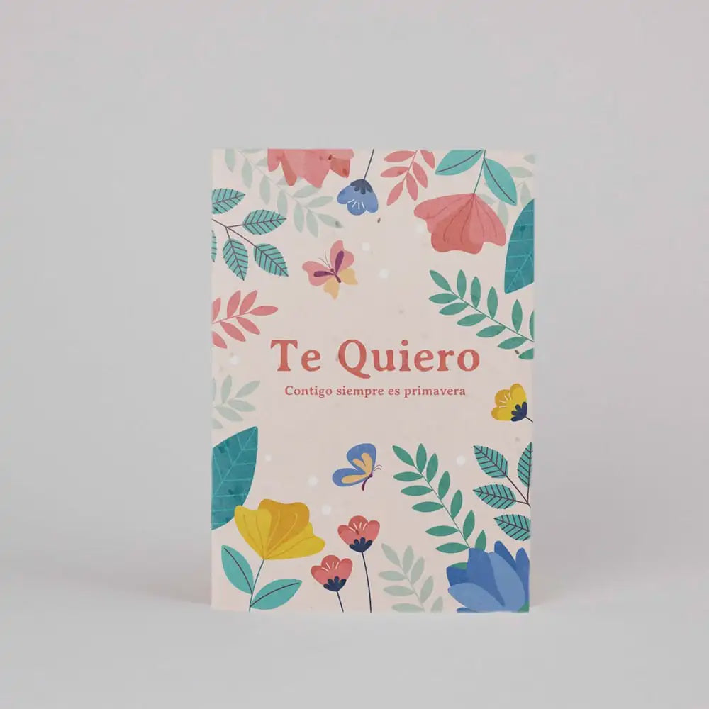 Postal con semillas plantable con ilustraciones de flores y el mensaje "Te quiero Contigo siempre es primavera"