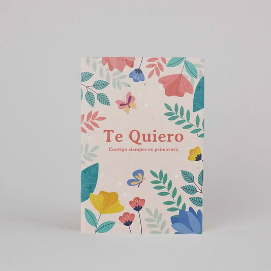 Postal con semillas plantable con ilustraciones de flores y el mensaje "Te quiero Contigo siempre es primavera"