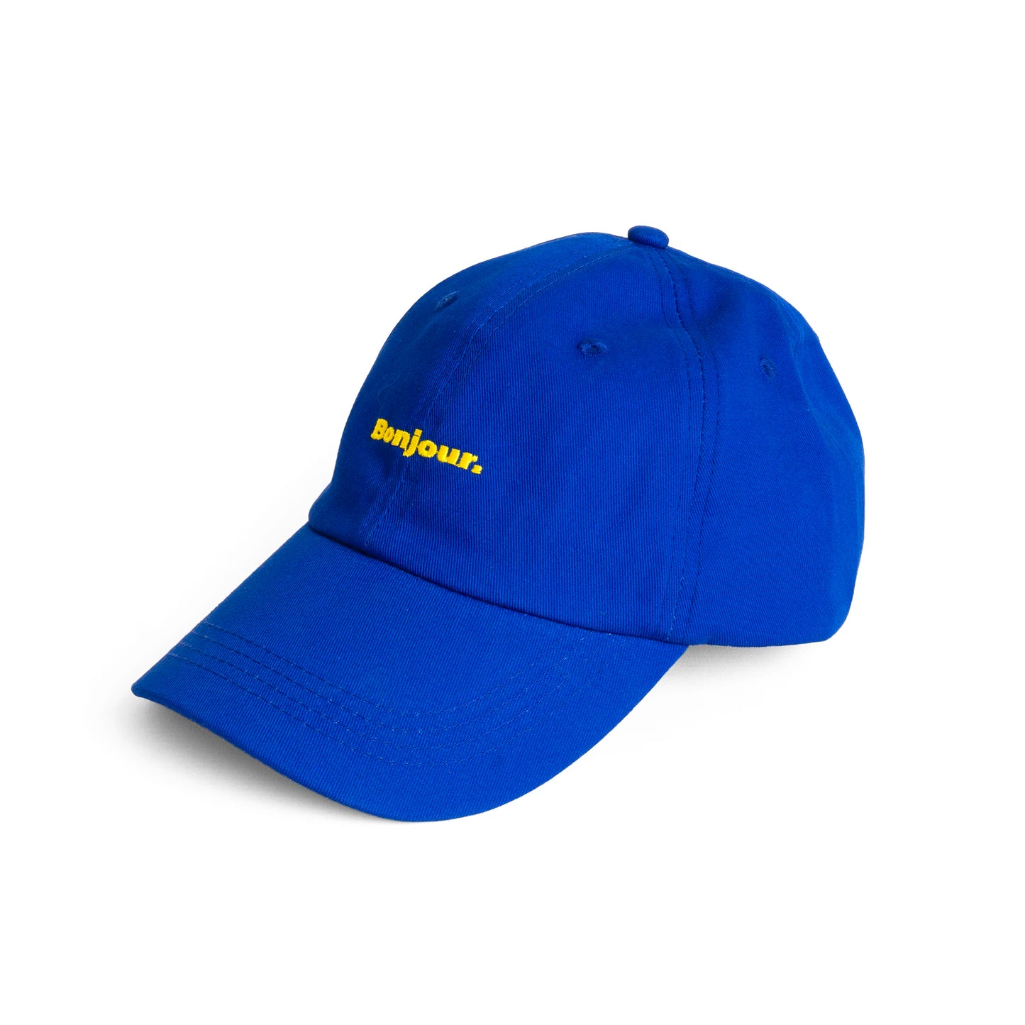 lateral de la gorra en color azul de Helio Ferretti con el texto Bonjour en amarillo