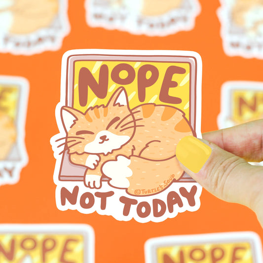 Pegatina con forma de gato dormido sobre el teclado de un portátil y el texto "NOPE Not Today"