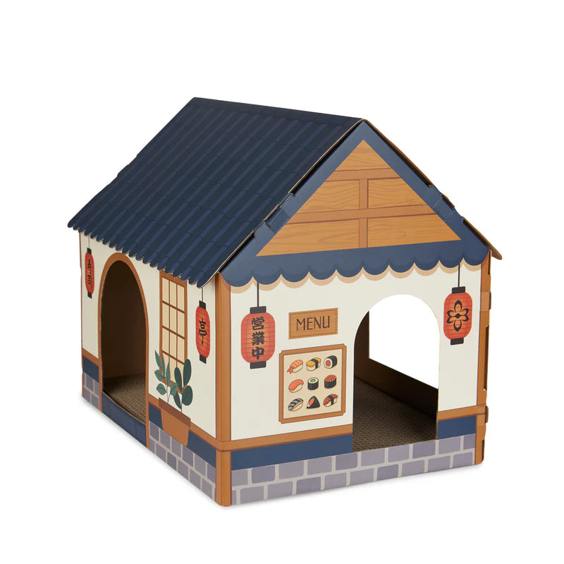 parte de atrás de la casa rascador para gatos en forma de puesto de sushi callejero japonés de cartón plegable, con rascador en la base y ventanas cortadas para que entre y salgan los gatos