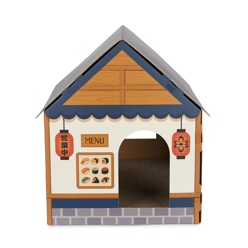 parte de delante de casa rascador para gatos en forma de puesto de sushi callejero japonés de cartón plegable, con rascador en la base y ventanas cortadas para que entre y salgan los gatos