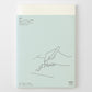 Agenda Midori MD 2027 A5 extra fina con cubierta en verde menta y ilustración minimalista de una mano escribiendo