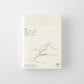 Portada de la agenda MD Notebook Diary A6 2027 con ilustración minimalista de mano escribiendo y texto en japonés e inglés