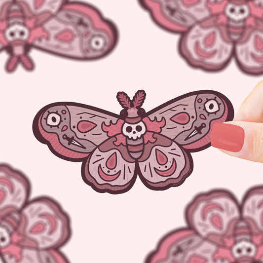 Pegatina con forma de polilla con símbolos de terror como calaveras y puñales