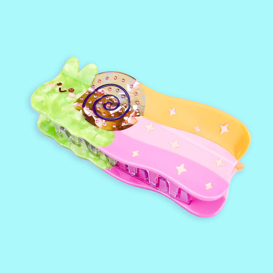 Pinza para el pelo de colores con forma de caracol dejando rastro de arcoiris