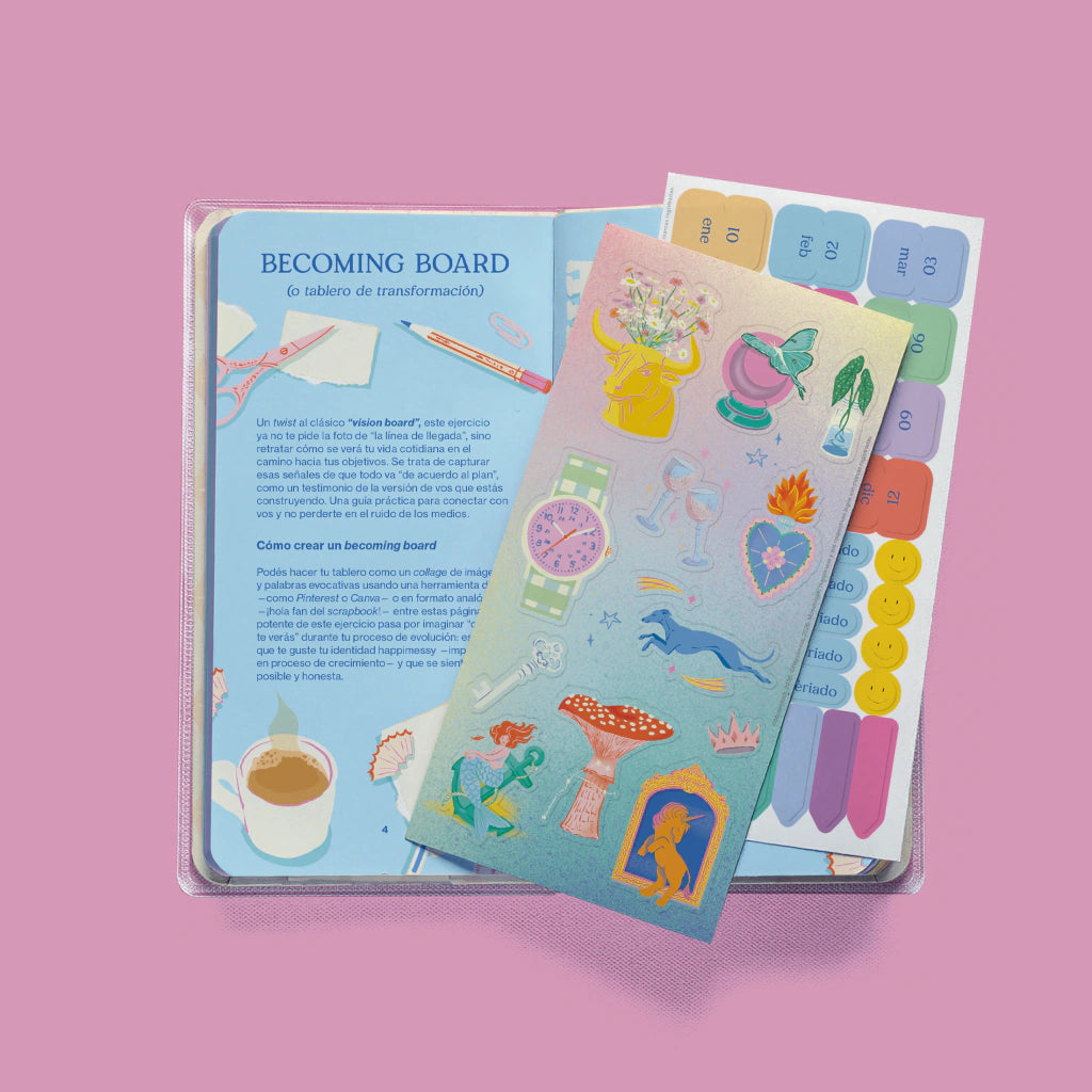 Agenda pocket Happimess Astro abierta mostrando el Becoming Board y plancha de stickers con ilustraciones