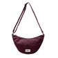 Bolso riñonera con forma de media luna color ciruela de la marca francesa Hindbag