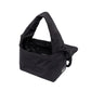 Interior abierto del mini bolso Ani de Lefrik en negro con bolsillo interior y etiqueta Lefrik visible
