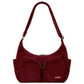 Bolso de pana rojo burdeos con doble cremallera, dos bolsillos frontales con cremallera y dos laterales sin y correa ajustable de la marca francesa Hindbag