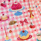detalle del pack de pegatinas de Laura Ortiz con purpurina y dibujos de tartas y cosas de picnic, cerezas, un lazo y una taza de café