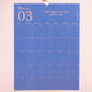 Página del mes de marzo en color azul con frase motivadora del calendario de pared 2027 de la artista argentina Happimess