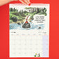 Página del mes de junio del calendario de pared 2027 de Macanudo con un duende meditando sobre una piedra en medio de un río y la frase "la paz que se siente cuando no tienes followers"