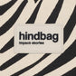 logo de hindbag sobre estampado cebra y color crema de fondo