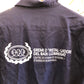 Logo estampado en la espalda de una chaqueta de trabajo vintage