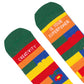 detalle de los calcetines de colores con puntera verde y el mensaje "Creativity / is your superpower" escrito en cada pie