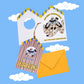 Tarjeta "Dear Friend" de Miss Feathers junto a su sobre a juego