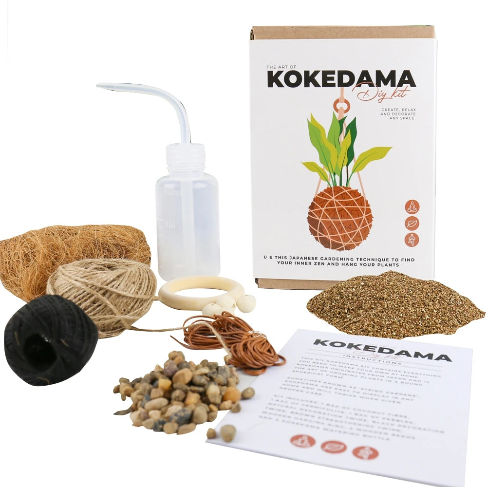 kit kokedama con elementos que se incluyen en la caja como cuerdas, rocas y tierra y la hoja de instrucciones