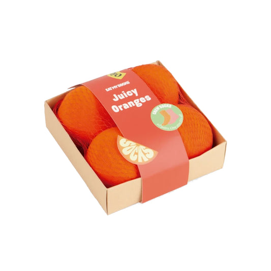 Caja de calcetines de Eat My Socks con dos pares de calcetines envueltos en forma de caja de naranjas, con el texto Juicy oranges