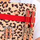 detalle de los bolis de acero inoxidable con estampado de leopardo y la frase my wild week