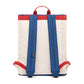Vista trasera de la mochila Bauhaus de Lefrik en azul marino y crema con correas rojas y cierre con mosquetones 100% reciclada