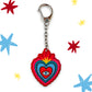 Llavero Corazón Mexicano de Laura Ortiz con corazones concetricos rojo amarillo azul y blanco y en el centro un ojo