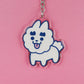 Llavero de acrílico reciclado con forma de perro caniche blanco