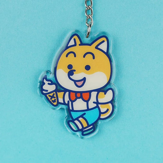 Llavero de acrílico con forma de perro shiva con un helado