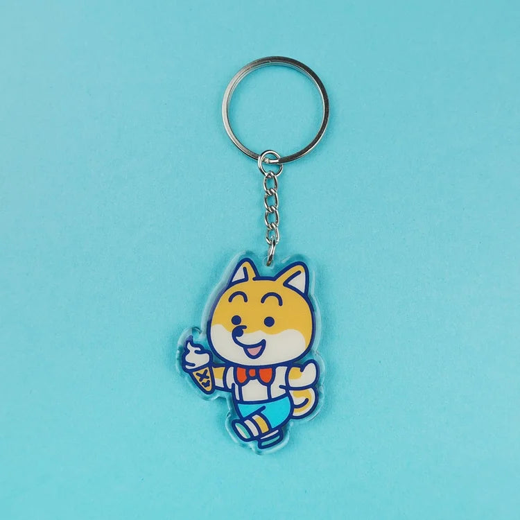 Llavero de acrílico con forma de perro shiva con un helado