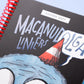 Detalle de portada negra de agenda 2027 Macanudo de Liniers con tipografía manuscrita y personaje Olga con gorro de fiesta