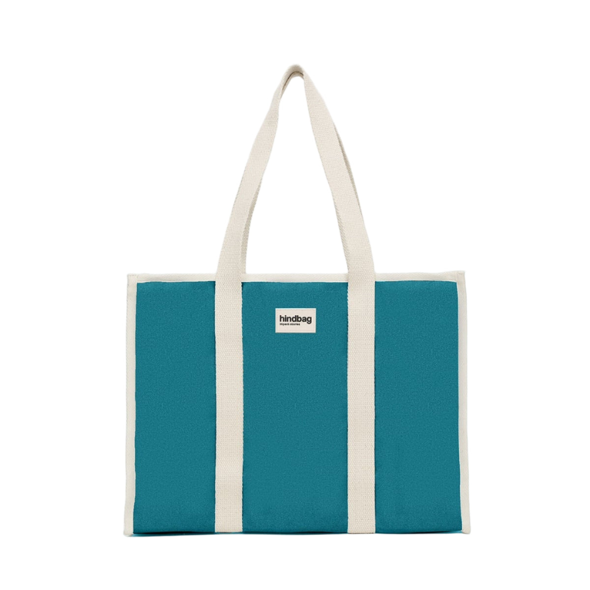 Bolso grande y cuadrado estilo tote bag de color azul turquesa con asas beige para llevar al hombro de la marca Hindbag
