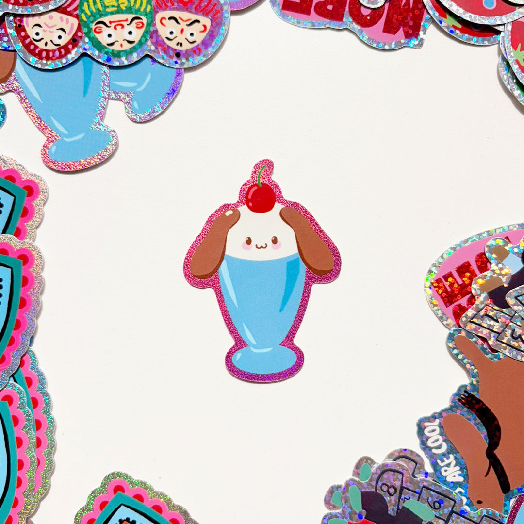 pegatina con forma de una copa de helado con cara de perrito de orejas largas y una cereza en lo alto