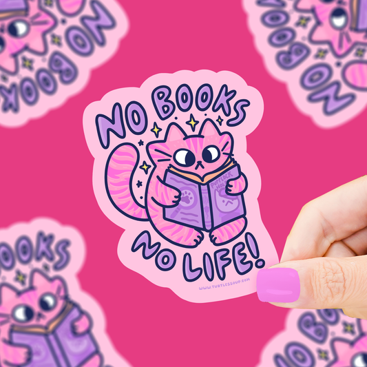 Pegatina con un gato rosa sujetando y leyendo un libro con la frase "no books no life!", sujetado con una mano. 