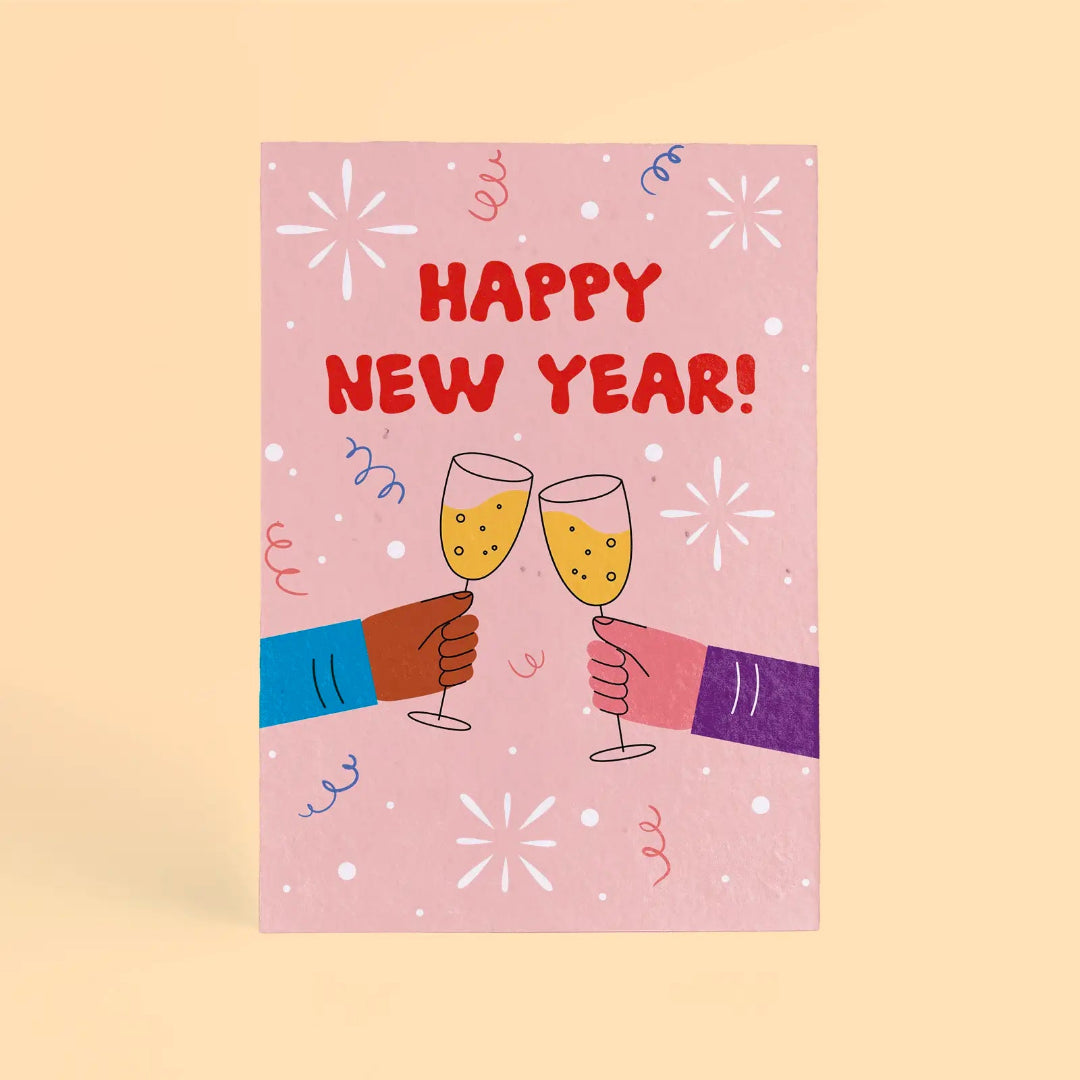 Tarjeta de Navidad plantable de Resetea, con ilustración de dos manos rindando con champán y el mensaje Happy New Year!