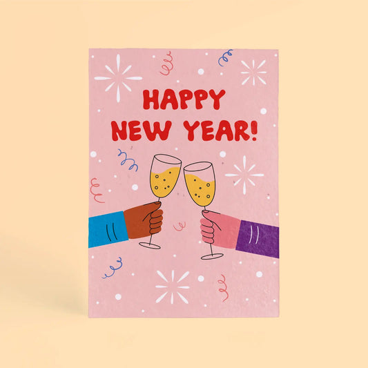 Tarjeta de Navidad plantable de Resetea, con ilustración de dos manos rindando con champán y el mensaje Happy New Year!