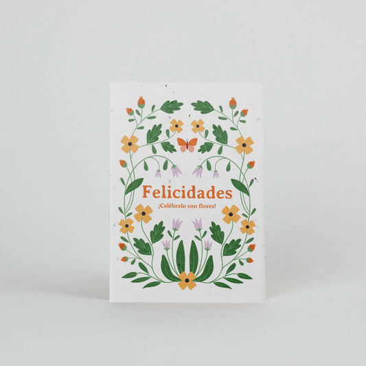 Tarjeta plantable de sheedo con el mensaje ¡Felicidades! Celébralo con flores