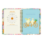 Páginas interiores de la agenda de Happimess 2026 Primavera, con checkpoint de junio y portadilla de julio con dos gatos en bicicleta