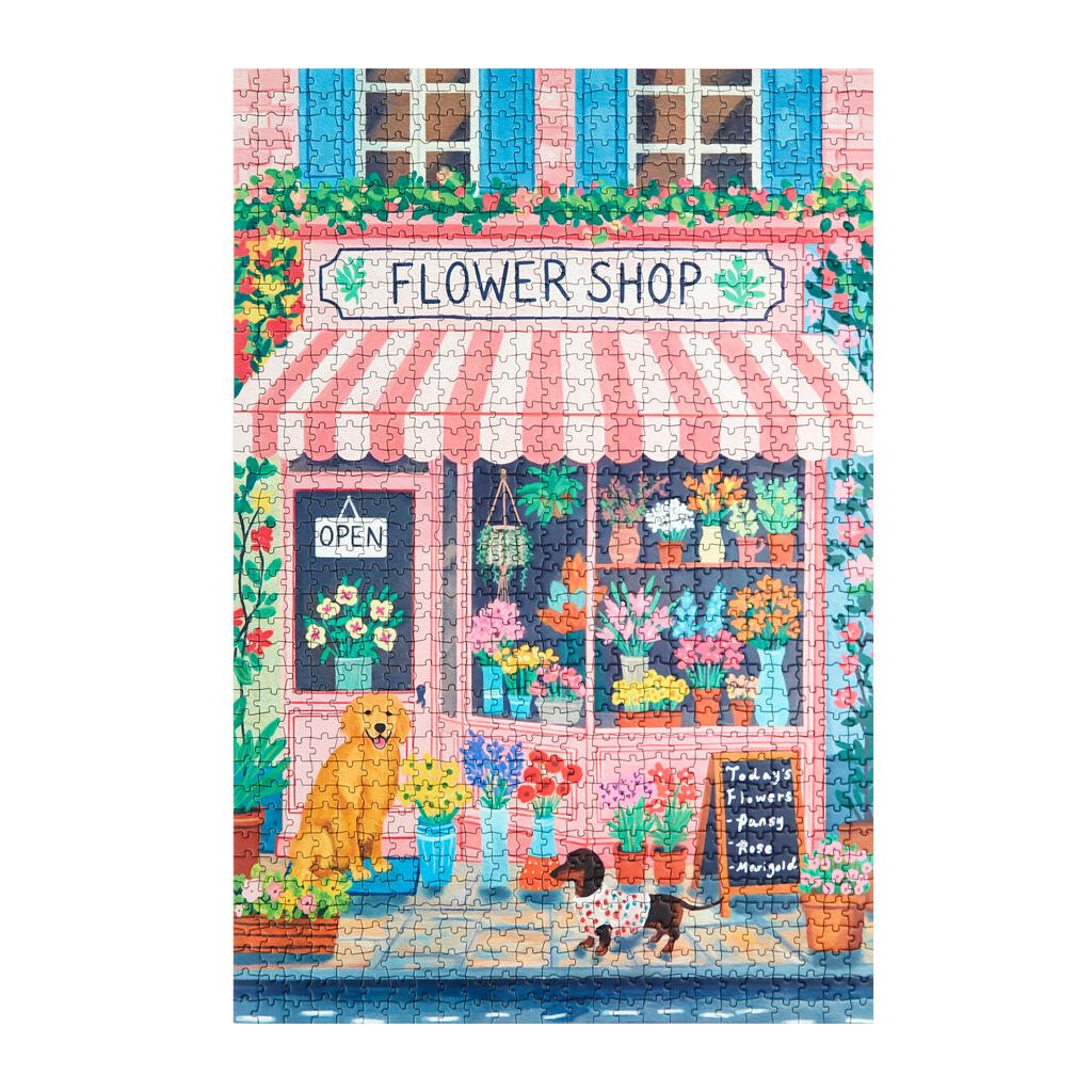 Puzzle montado de 1000 piezas con ilustración de la fachada de una floristería y dos perritos