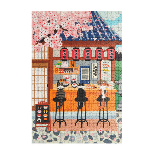 Puzzle de 1000 piezas con ilustración de tres gatos comiendo sushi en un restaurante japonés