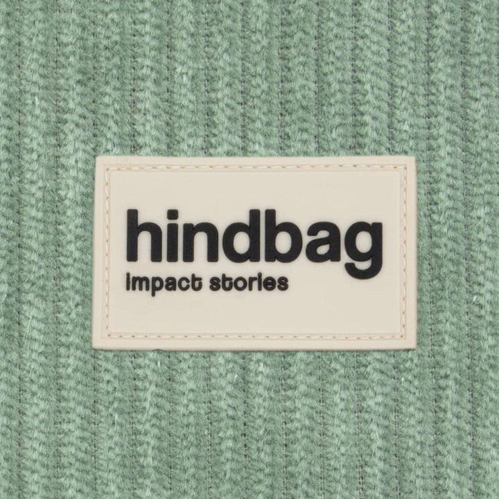 Tejido de pana verde agua con la etiqueta de marca de Hindbag