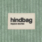 Tejido de pana color verde agua con etiqueta de la marca Hindbag