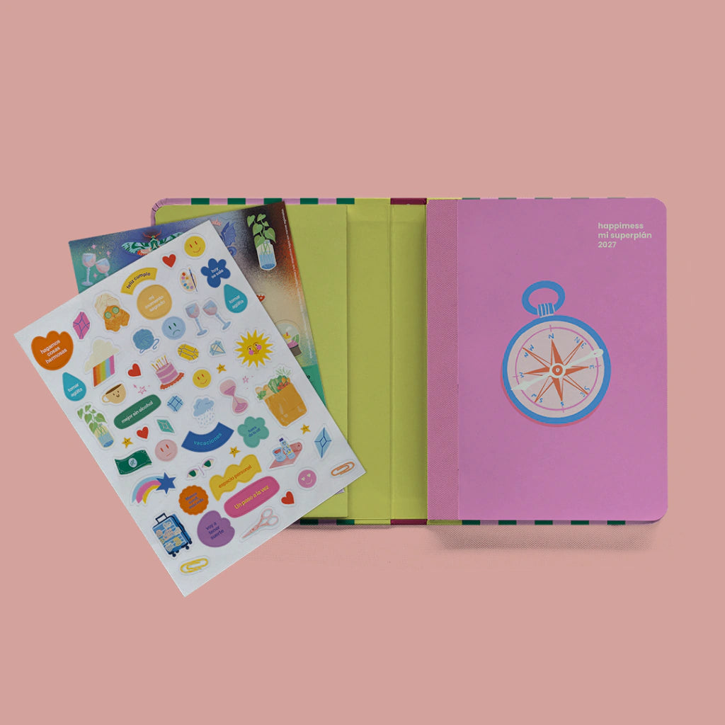 Agenda Mi Superplán 2027 Rainbow Dancer Happimess abierta con plancha de stickers incluida y tapa rosa con brújula
